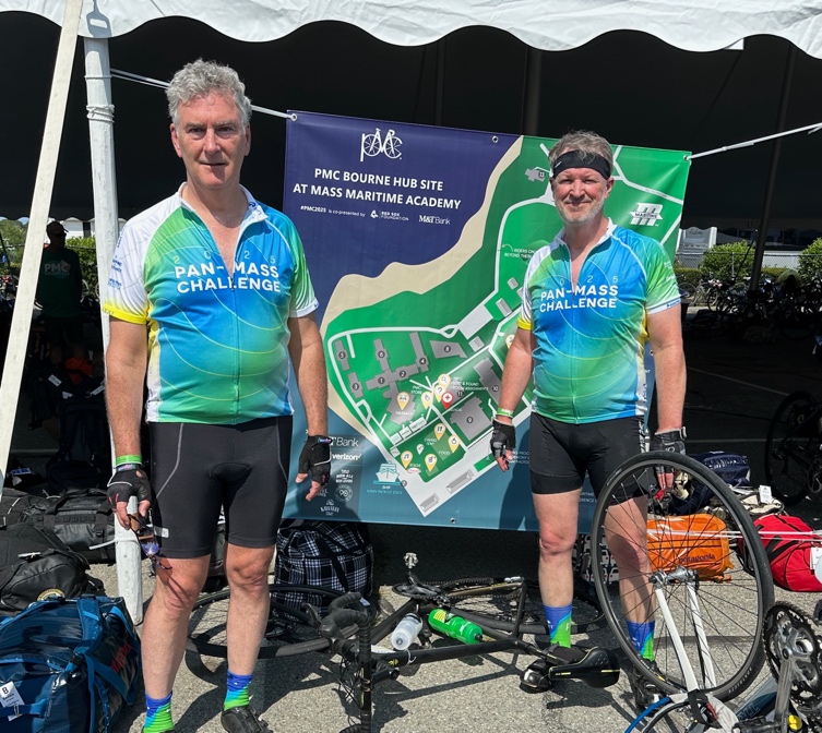 Two men wearing cycling jerseys
AI-generated content may be incorrect.