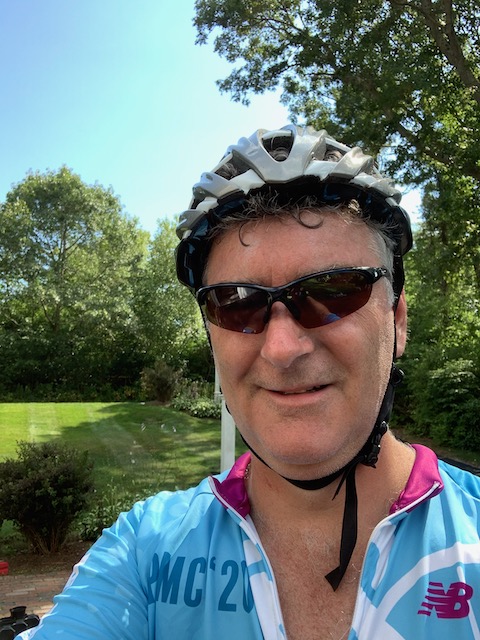 A person wearing a hat and sunglasses
Description automatically generated