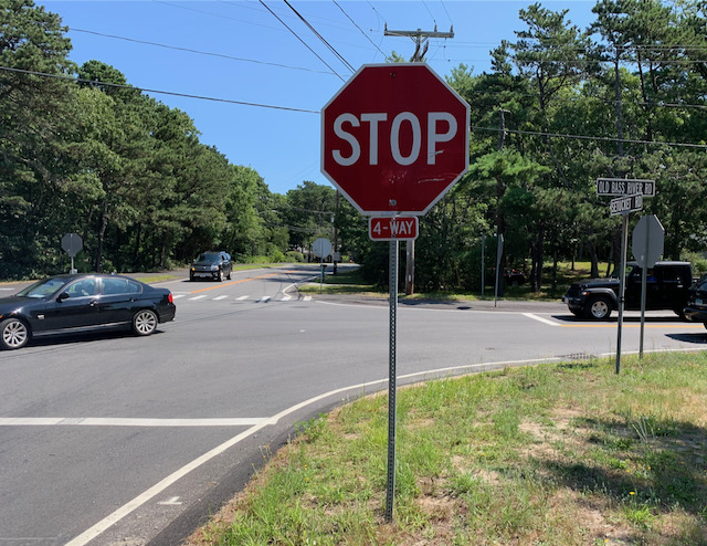 A stop sign on the side of a road

Description automatically generated with medium confidence